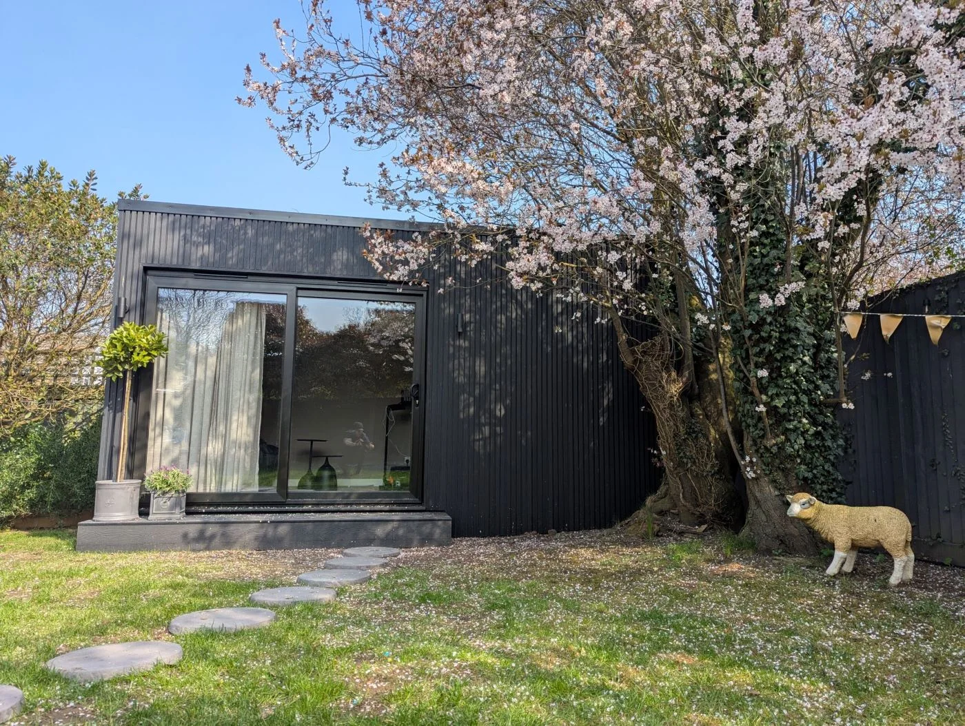 A completed Cedar Spaces garden gym with black composite cladding
